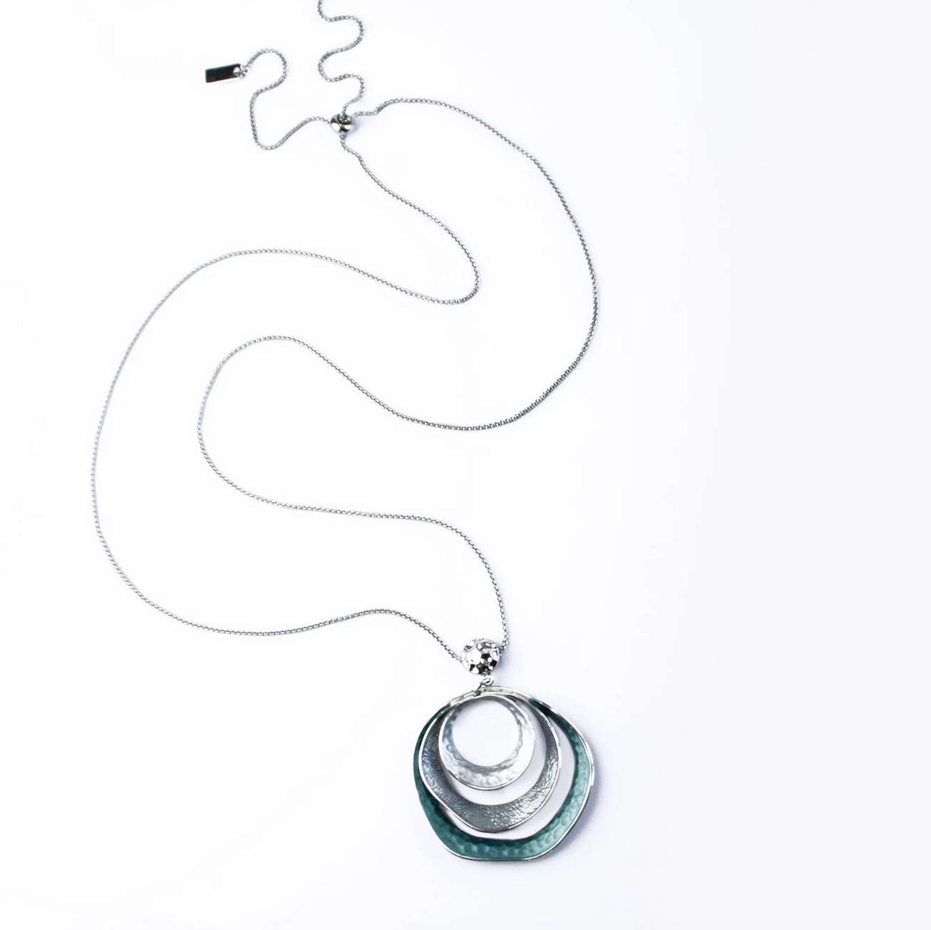 beautiful three-ring circles statement necklace with silver and blue tones on white background boho bohemian