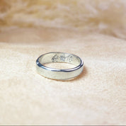 "Sterling silver 4mm engraved ring with personalized inside message in Chinese characters, showcasing the ability to customize bands with different languages, symbols, or meaningful phrases. This unisex slim band is ideal for everyday wear or special occasions such as anniversaries, weddings, or memorial gifts. Handcrafted and engraved with precision, this unique jewelry piece allows names, dates, or foreign script to be permanently inscribed for a timeless keepsake.