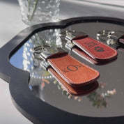 Personalized leather keychain video. Select from preset monograms, stock prints or create your very own design. Great for gifting.