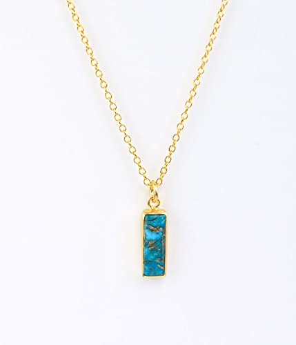 Vertical copper turquoise Adira bar necklace with gold filled cable chain with background. December Birthstone