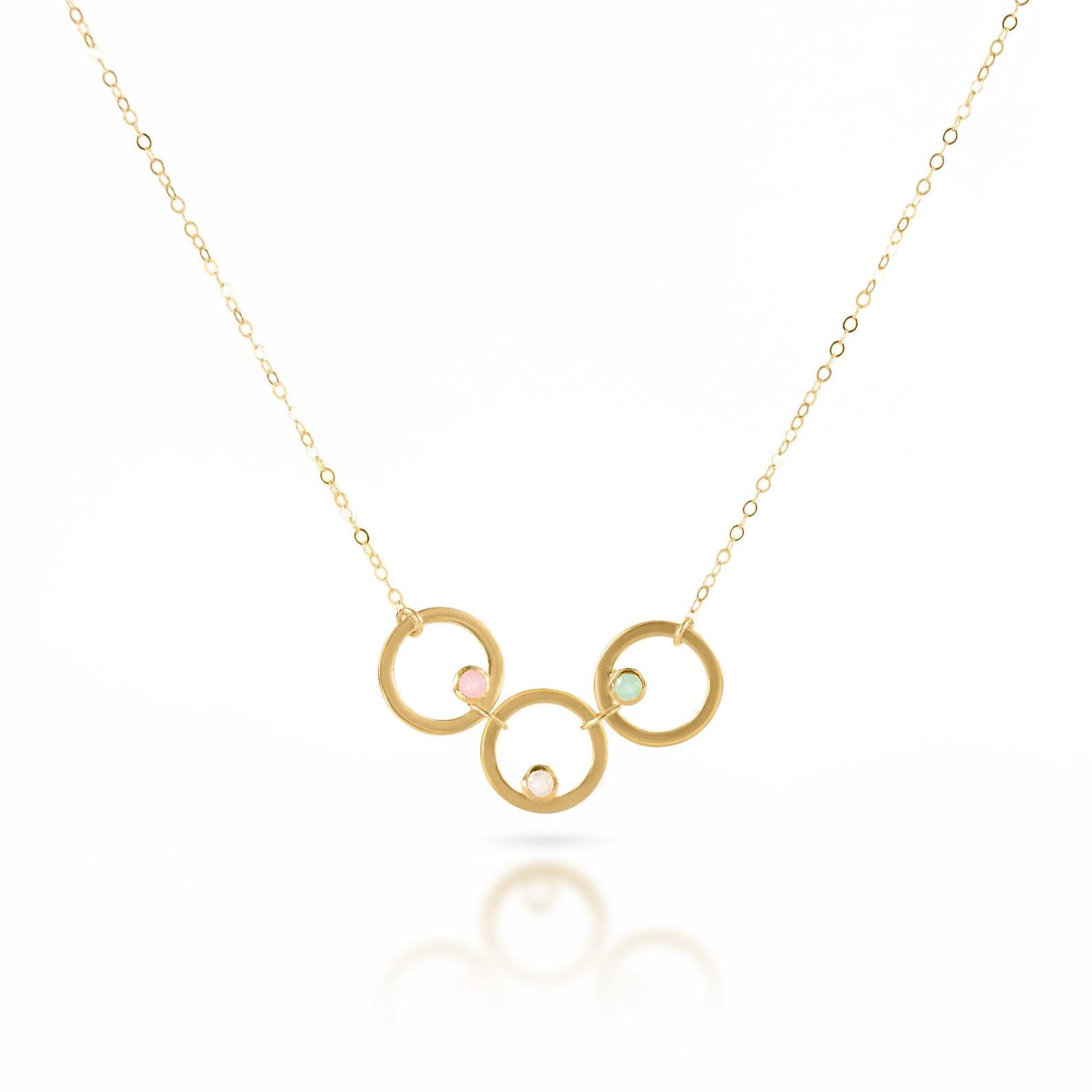 Single gold filled open circle necklace with 3 circles and stones including pink chalcedony, moonstone and aqua chalcedony.