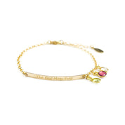 Gold filled dainty bar bracelet engraved with script font with the best mom ever quote and peridot, ruby, and clear birthstones
