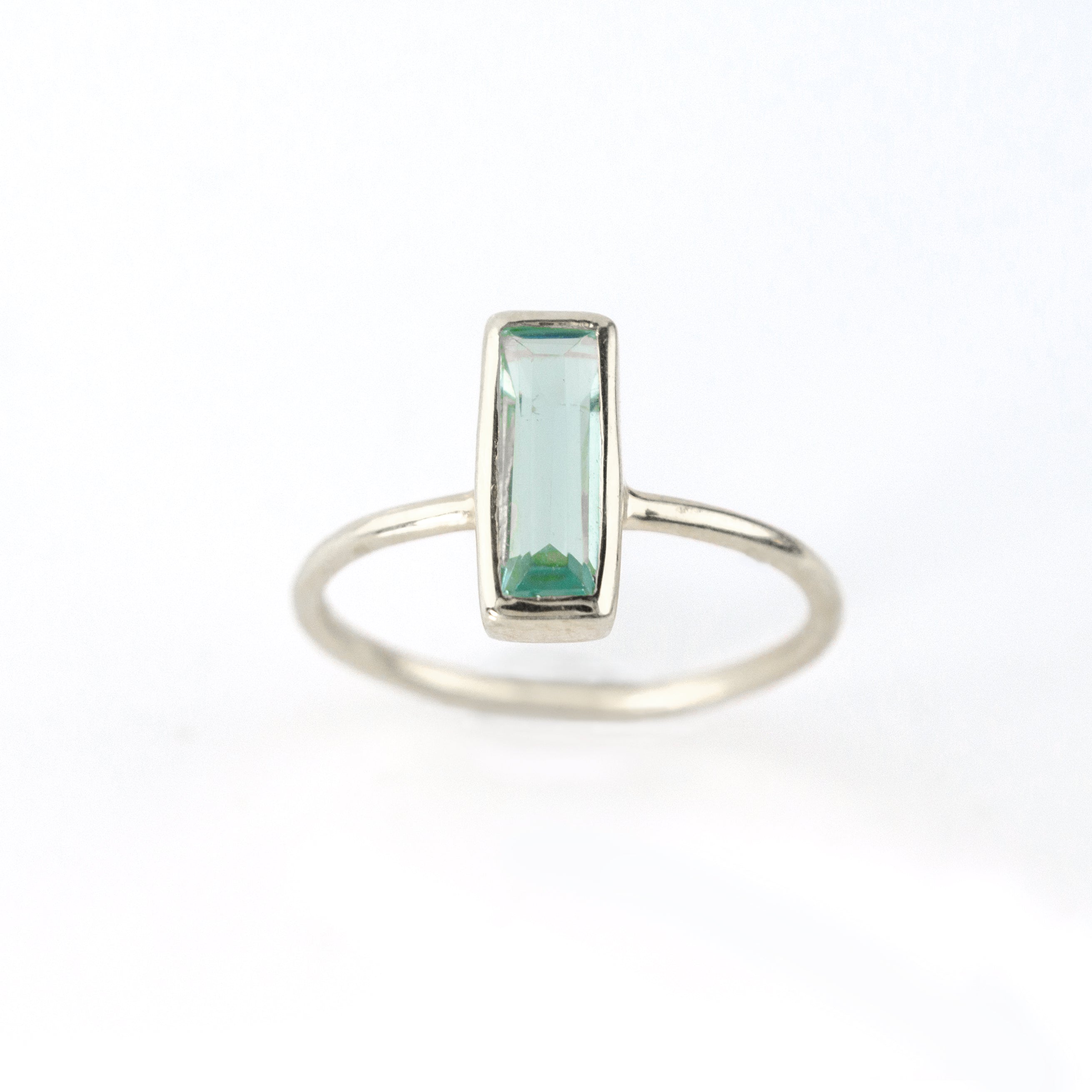 Sterling silver tiny blue topaz rectangle ring rectangle birthstone rectangle gemstone on white background light blue ring blue ring bar ring