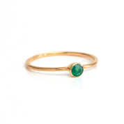 Single rose gold plated green onyx birthstone dainty gemstone ring on a white background. May birthstone.