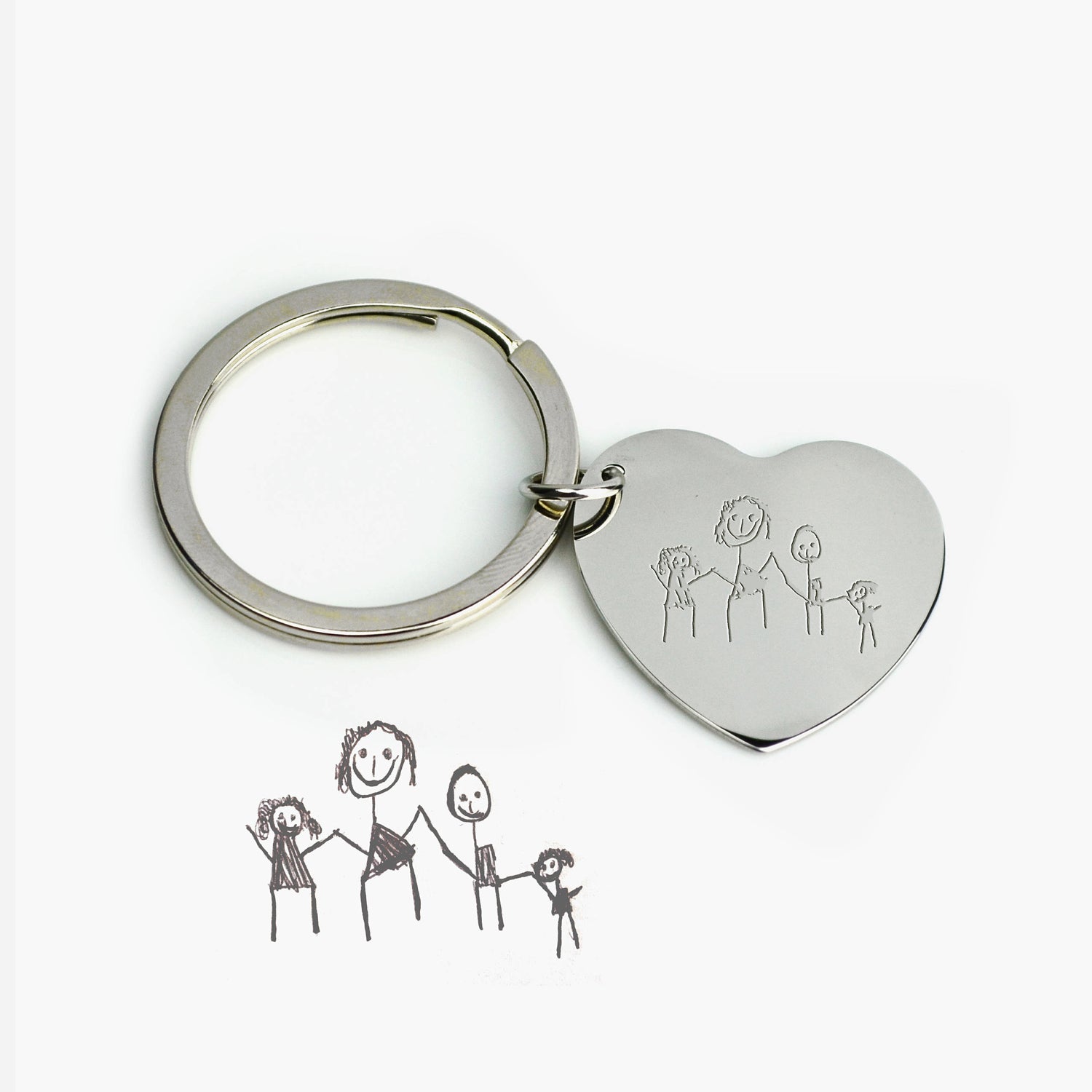 Forever engrave a child's drawing onto scratch-resistant zinc alloy heart. Choose a different design or engrave a phrase on the other side.