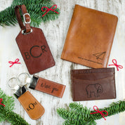 Full collection of leather goods, two custom leather keychains, luggage tag, passport holder and card holder.