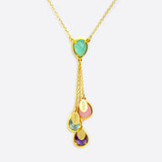 Single mother's gold lariat necklace with aqua chalcedony double loop teardrop birthstone and aqua chalcedony double loop teardrop birthstone, three hanging birthstones with full names engraved on name tags. Stones include: pinky chalcedony, blue topaz and purple amethyst