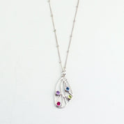 Sterling silver Butterfly pendant wing birthstone necklace satellite chain and purple amethyst, ruby, iolite and peridot gemstones.