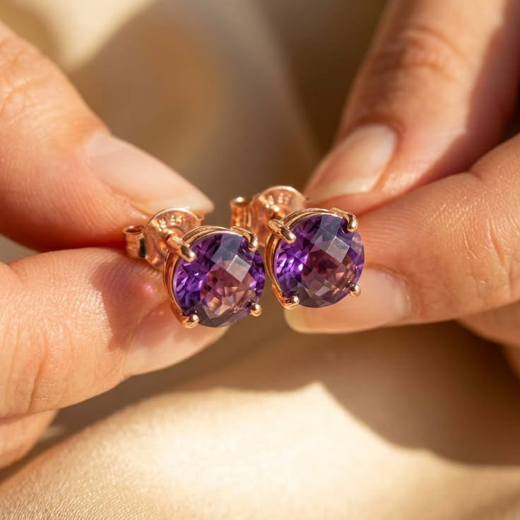 Amethyst stud earrings in rose gold held in hand, elegant gemstone studs for women, perfect gift for Mother’s Day, birthday jewelry, bridesmaid earrings, wedding accessories, minimalist fine jewelry