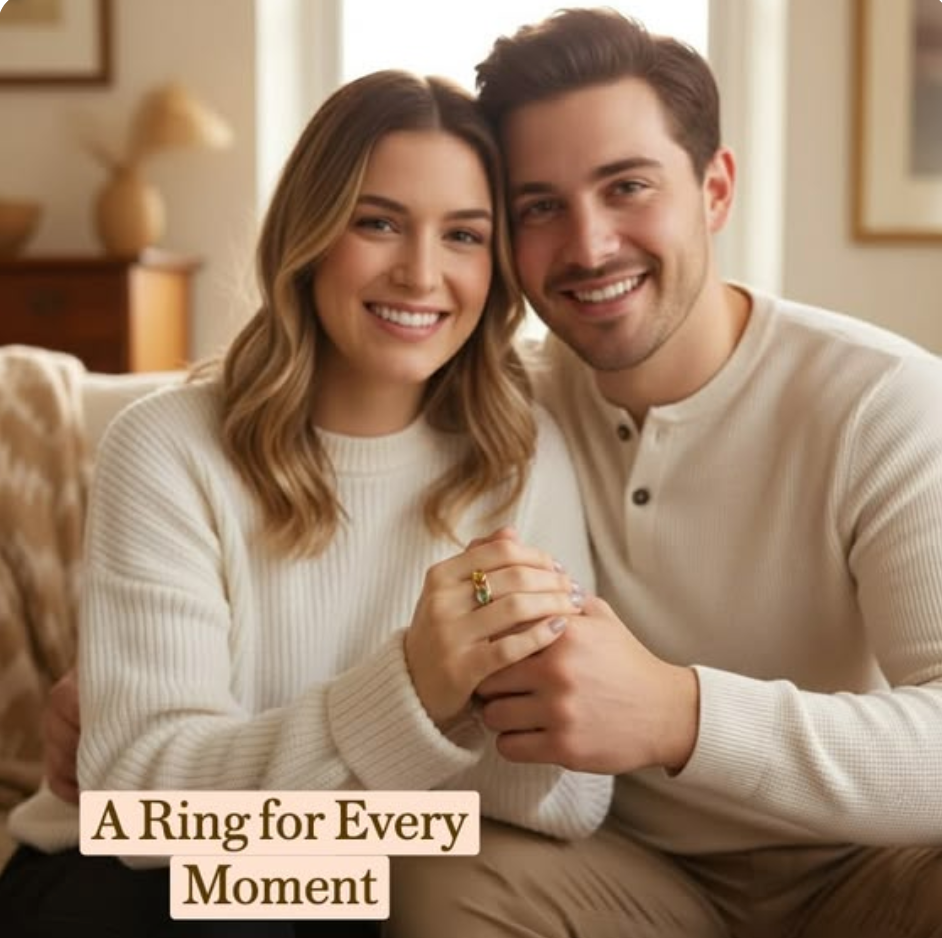 Smiling couple sitting together at home, woman wearing stackable oval birthstone rings with colorful gemstones, personalized stacking rings symbolizing family, love, and meaningful life moments.