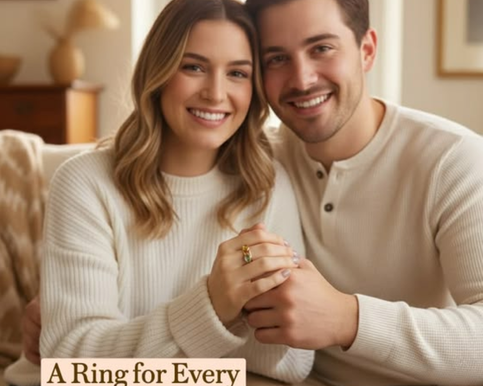 Smiling couple sitting together at home, woman wearing stackable oval birthstone rings with colorful gemstones, personalized stacking rings symbolizing family, love, and meaningful life moments.