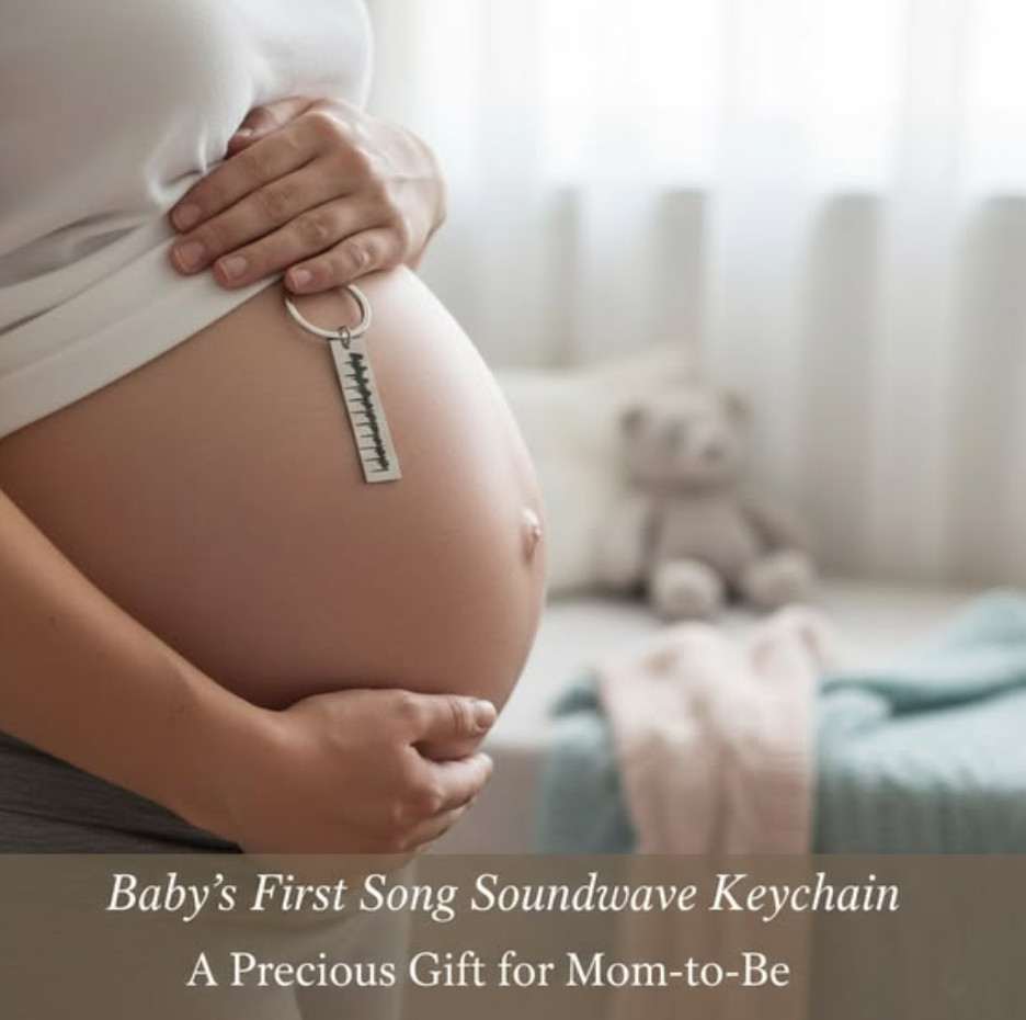 Pregnant woman holding her baby bump with a silver soundwave keychain resting against her belly, styled in a soft nursery setting with text about baby’s first song and a gift for mom-to-be.
