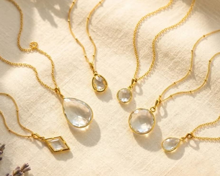 Clear quartz April birthstone necklaces in gold on linen background, minimalist gemstone jewelry for women, elegant gift for Mother’s Day, birthday, bridal jewelry, wedding accessories, dainty layering necklaces