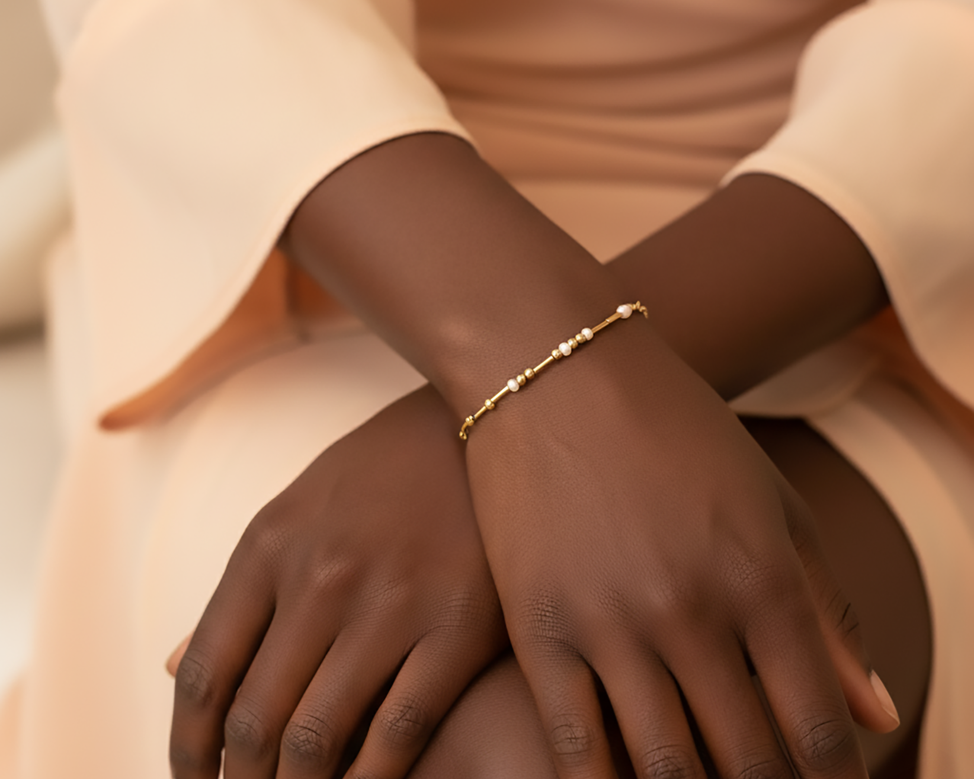 Minimalist gold Morse code bracelet with delicate beads spelling a hidden message worn on a model’s wrist, elegant dainty bracelet jewelry gift for friend, meaningful secret message bracelet