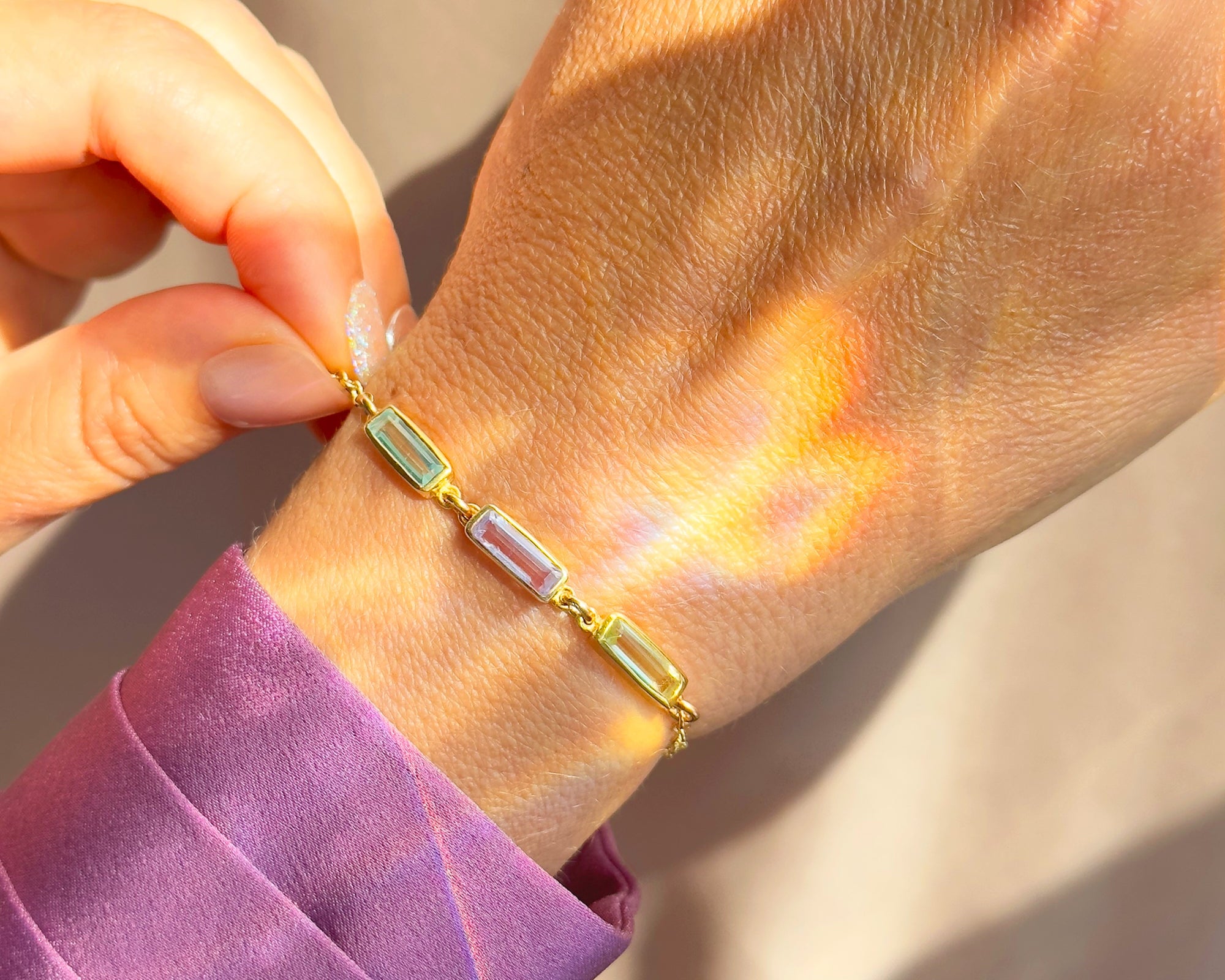 Custom baguette birthstone bracelet in gold with rectangular gemstones on wrist, personalized family birthstone bracelet for mom, minimalist gold birthstone jewelry, custom birthstone bracelet gift for women