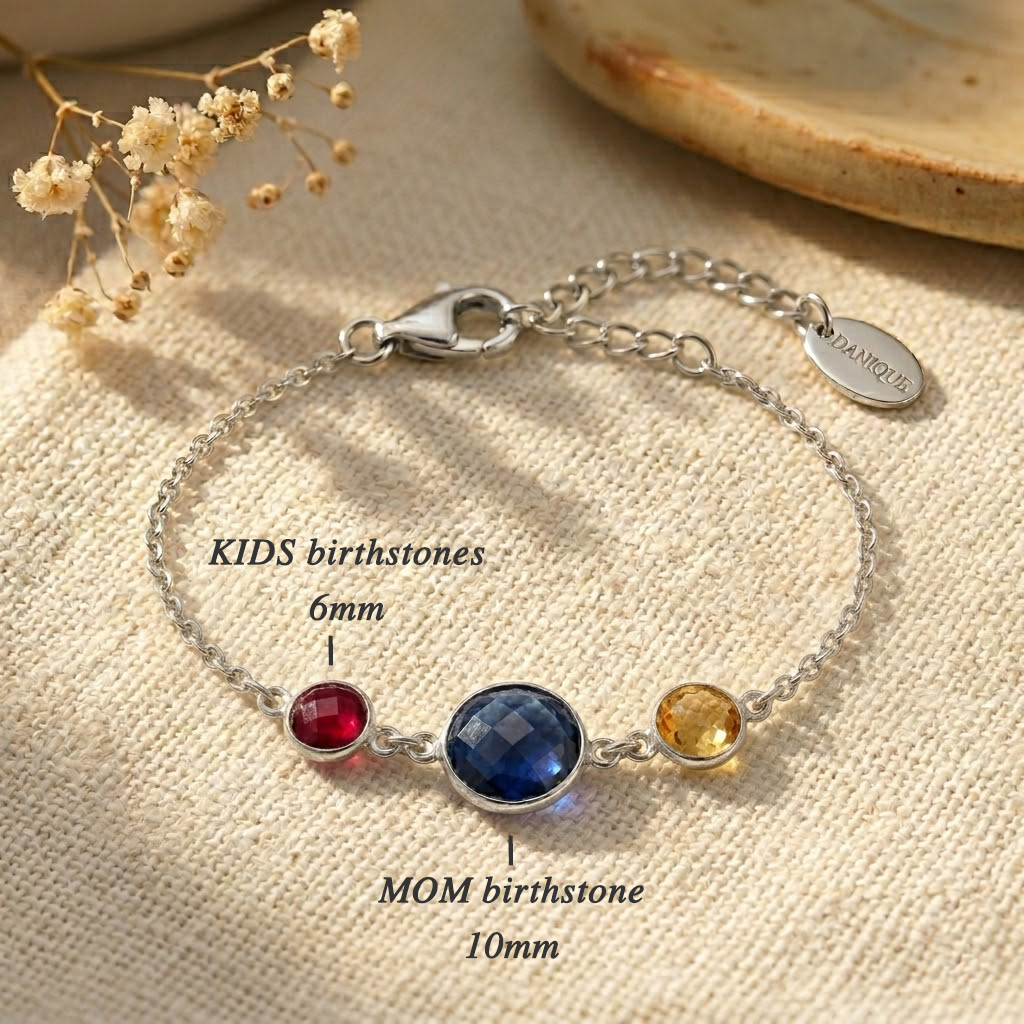 Personalized birthstone bracelet shown on a model’s wrist, featuring colorful gemstones for kids, grandkids, or loved ones.
