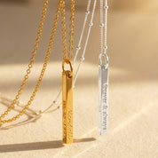 A sleek minimalist engraved 3D bar necklace shown in gold and silver with slim vertical bars engraved “Kendall” and “forever & always,” highlighting deep laser engraving and polished edges. This custom name necklace can feature names, initials, dates or coordinates on up to four sides; available in gold-filled, sterling silver and rose finishes—an elegant everyday keepsake and gift for women or men who love vertical name necklace styles.
