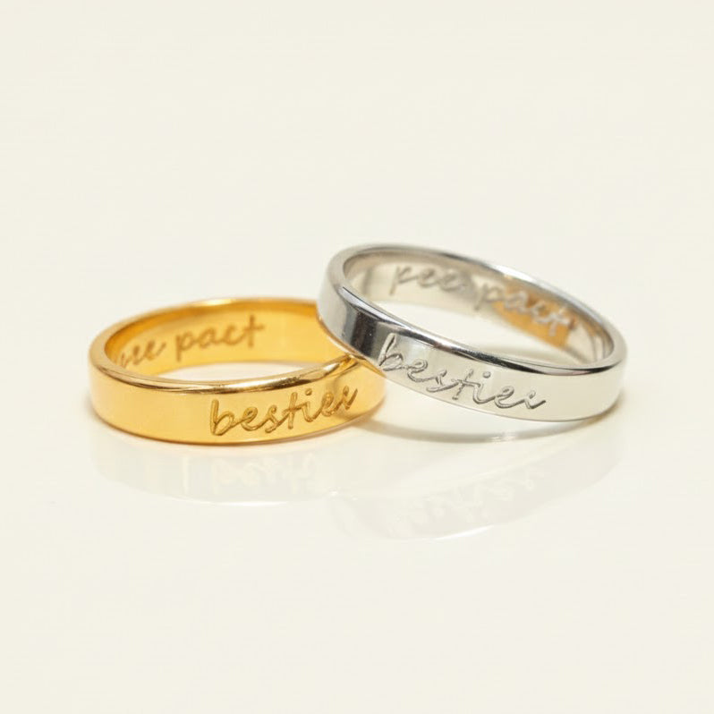 Custom handwriting engraved rings in gold and silver with visible cursive text personalization. Slim 4mm unisex bands designed for names, dates, or meaningful phrases. Ideal as personalized wedding bands, promise rings, or anniversary gifts, these engraved rings capture handwriting or coordinates for a deeply meaningful keepsake. Handmade in sterling silver, gold, or rose gold with lasting engraving detail.