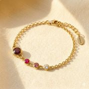 Personalized birthstone bracelet for mom with children’s birthstones and engraved initial charms, meaningful Mother’s Day jewelry gift representing family love
