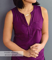 A person in a purple shirt wears an 18 inch bar necklace. Personalized bar necklace for special events Custom bar pendant with initials Engraved bar necklace for her special occasion Personalized minimalist bar necklace with message Custom bar necklace for personalized moments Engraved bar pendant for holidays Personalized bar necklace for unique gifts Custom minimalist bar jewelry piece