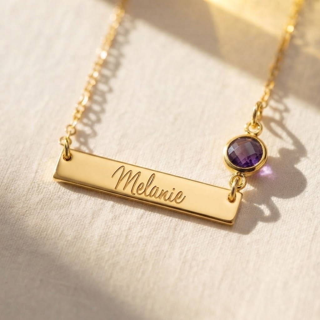Personalized gold bar necklace engraved Melanie with purple birthstone connector