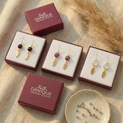 Custom birthstone earrings with marquise tags in Danique gift boxes, ready for gifting