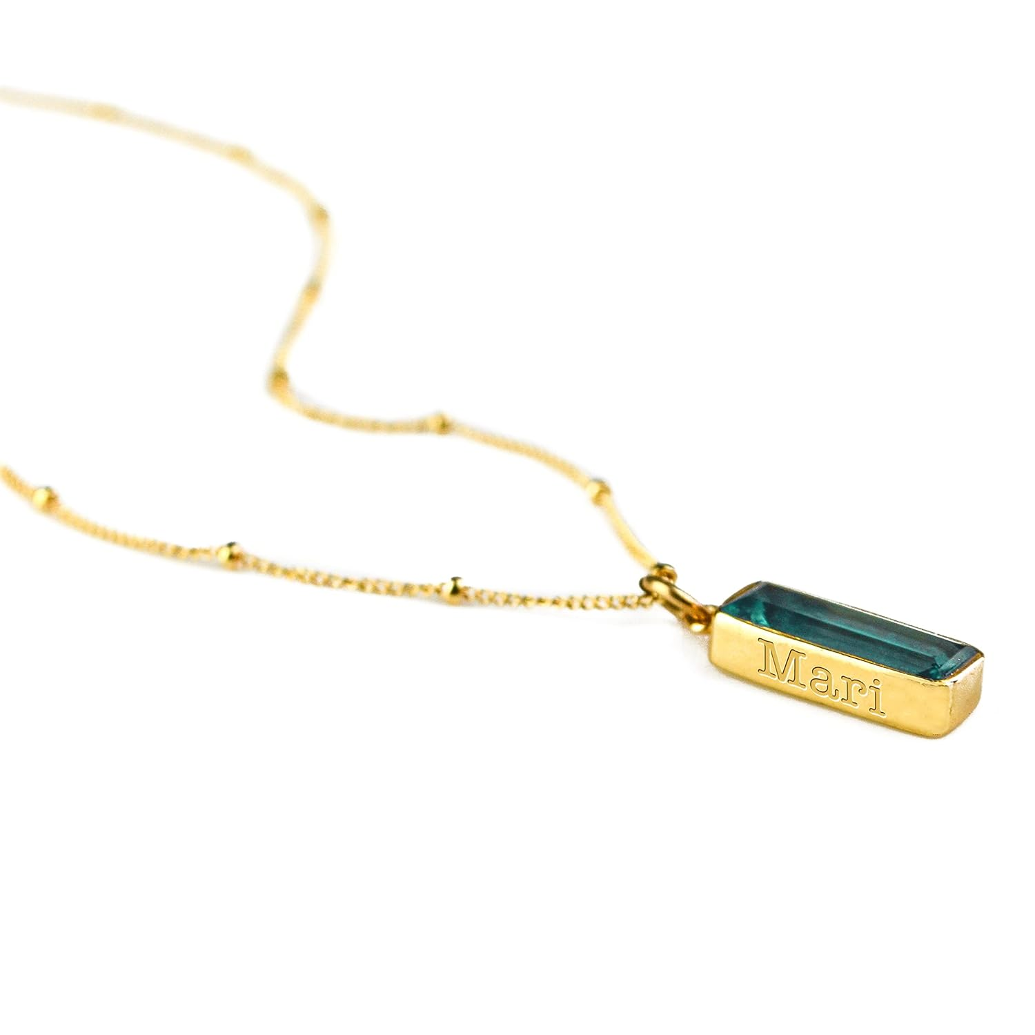 Single gold filled satellite chain with green tourmaline vertical adira birthstone bar necklace with name engraved in typewriter font. 