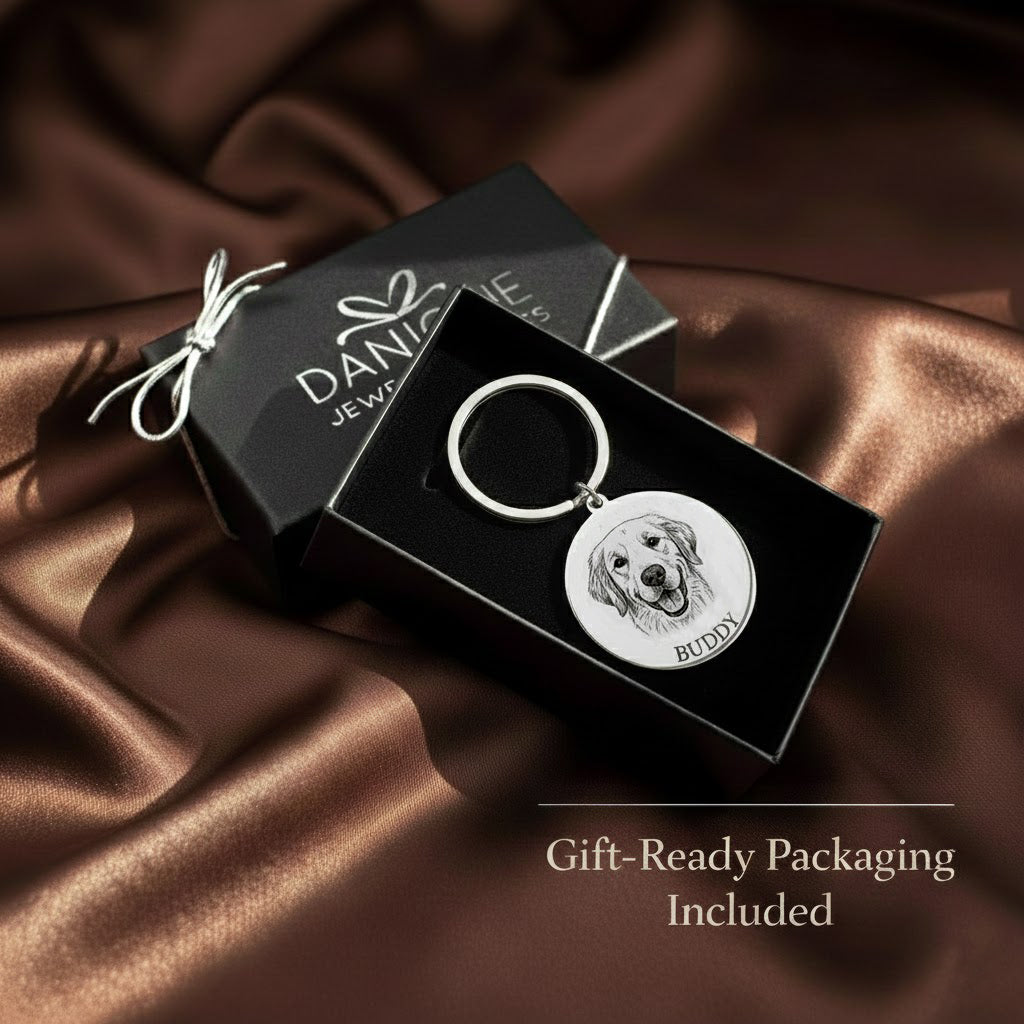 Custom engraved pet portrait keychain displayed in Danique Jewelry gift box on satin fabric, featuring a detailed engraved dog portrait and pet name. Personalized pet keychain crafted from durable metal and presented in gift-ready packaging. Meaningful pet keepsake keychain perfect for dog lovers, memorial pet gifts, birthdays, holidays, or sentimental remembrance gifts for pet parents.