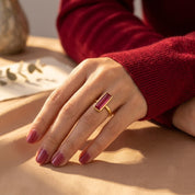 Ruby quartz ring worn as a modern July birthstone stacking ring.