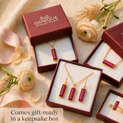 Ruby Quartz earrings displayed in a Danique Jewelry gift box with matching pieces