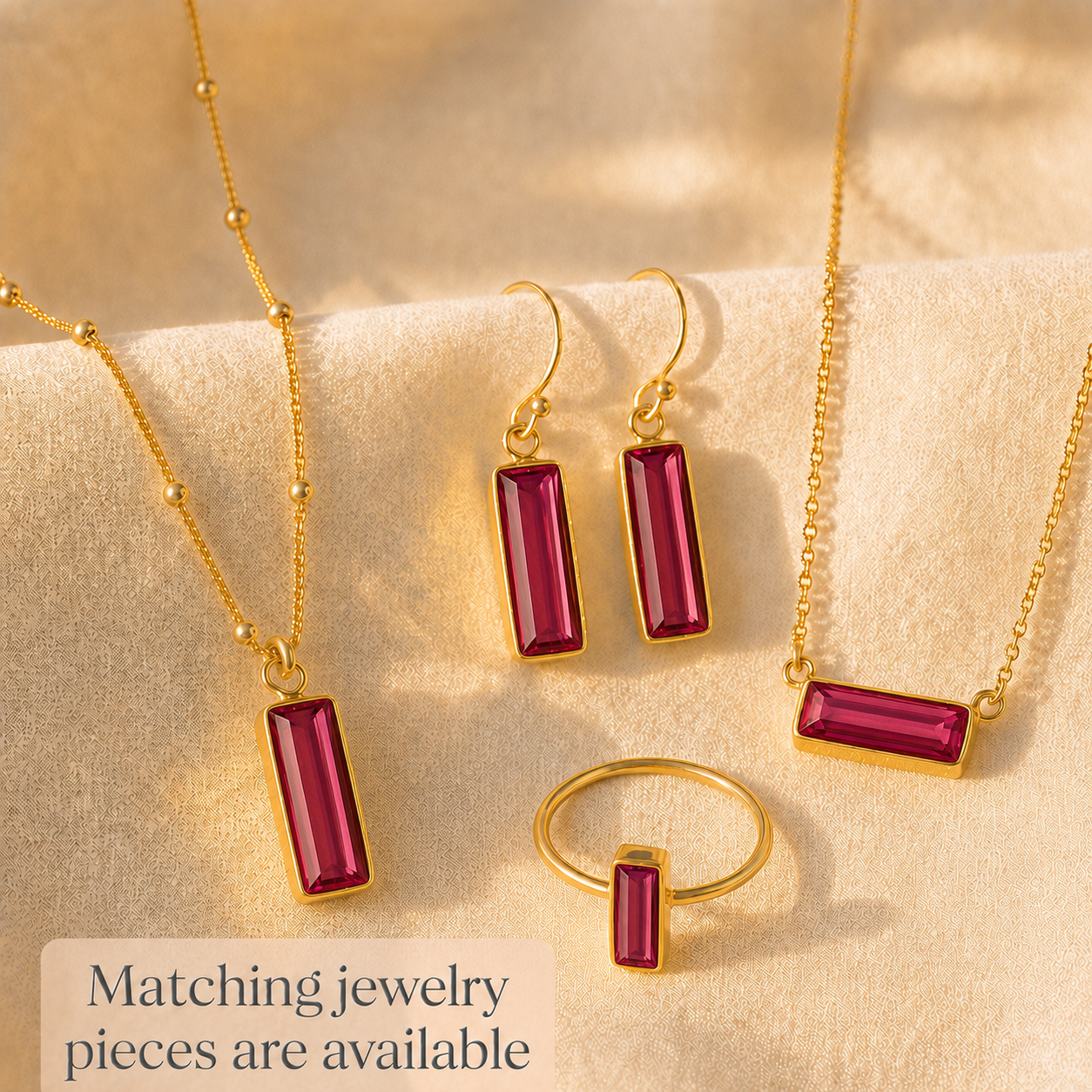 Matching Adira Ruby Quartz earrings, necklace, and ring jewelry set