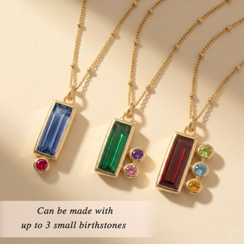 Personalized mom birthstone necklace with one large baguette stone representing mom and up to three small round birthstone charms representing her children.