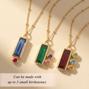 Personalized mom birthstone necklace with one large baguette stone representing mom and up to three small round birthstone charms representing her children.