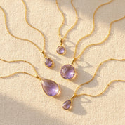 Alexandrite June birthstone necklaces in multiple pendant sizes with soft purple gemstones on gold chains.