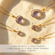Alexandrite necklace size chart showing small and large round and teardrop pendant options.