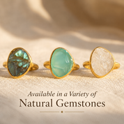 Large rough cut aqua chalcedony, labradorite and moonstone teardrop rings in yellow gold vermeil displayed in natural light.