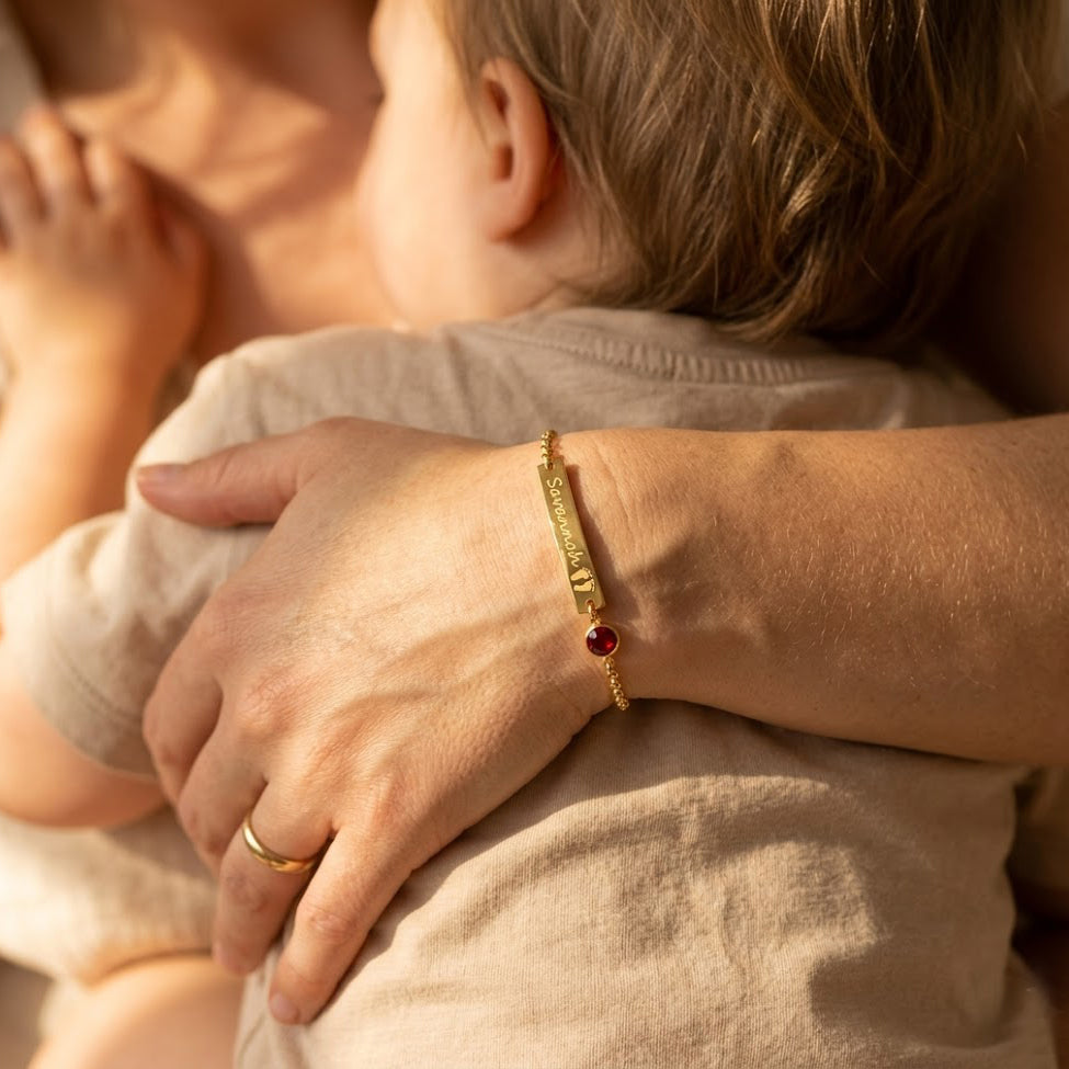 Custom engraved footprint bar bracelet with round birthstone in gold