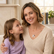 Mother and daughter wearing custom engraved birthstone necklace for mom, meaningful personalized family jewelry gift