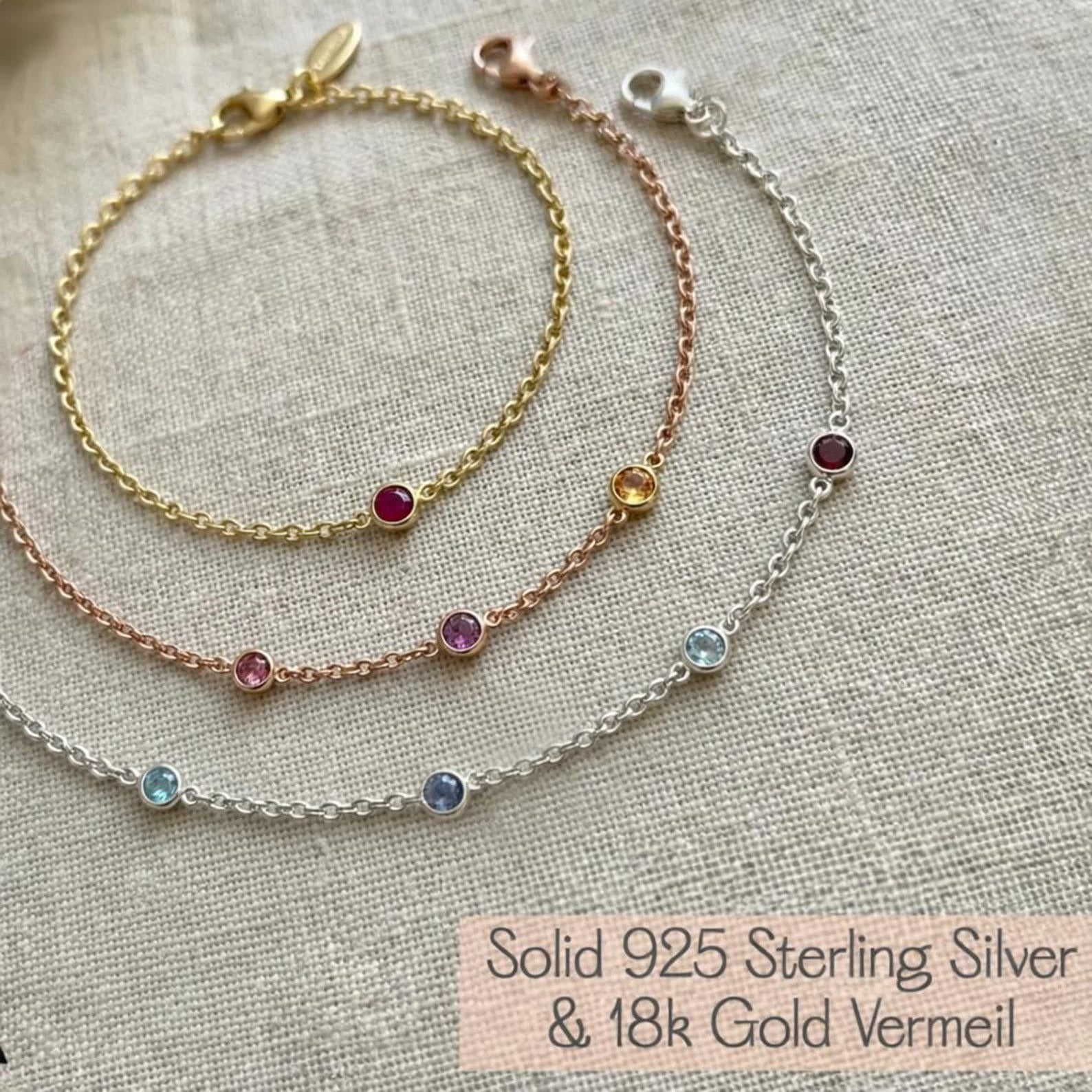 Custom birthstone bracelet shown in sterling silver, yellow gold, and rose gold finishes, featuring tiny bezel-set natural gemstones on delicate chains. Personalized family bracelet designed for moms and grandmas, offering metal options to match any style. Minimalist birthstone jewelry gift for Mother’s Day, birthday, or anniversary.