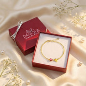 Danique Jewelry gift box with custom birthstone bracelet and engraved initial leaf charm, ready to gift personalized bracelet for mom, grandma, or bridesmaid