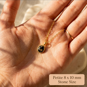 Close-up of 8 x 10 mm oval Black Copper Obsidian gemstone pendant