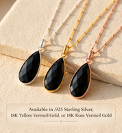 Black Onyx teardrop necklaces shown in sterling silver, yellow gold and rose gold finishes.
