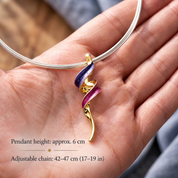 Abstract spiral pendant necklace with purple and magenta enamel accents, polished gold details, silver multi-strand collar, 6 cm pendant, adjustable 17–19 inch necklace.