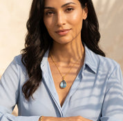 Blue topaz necklace on model in gold, sparkling December birthstone pendant, elegant gift for her