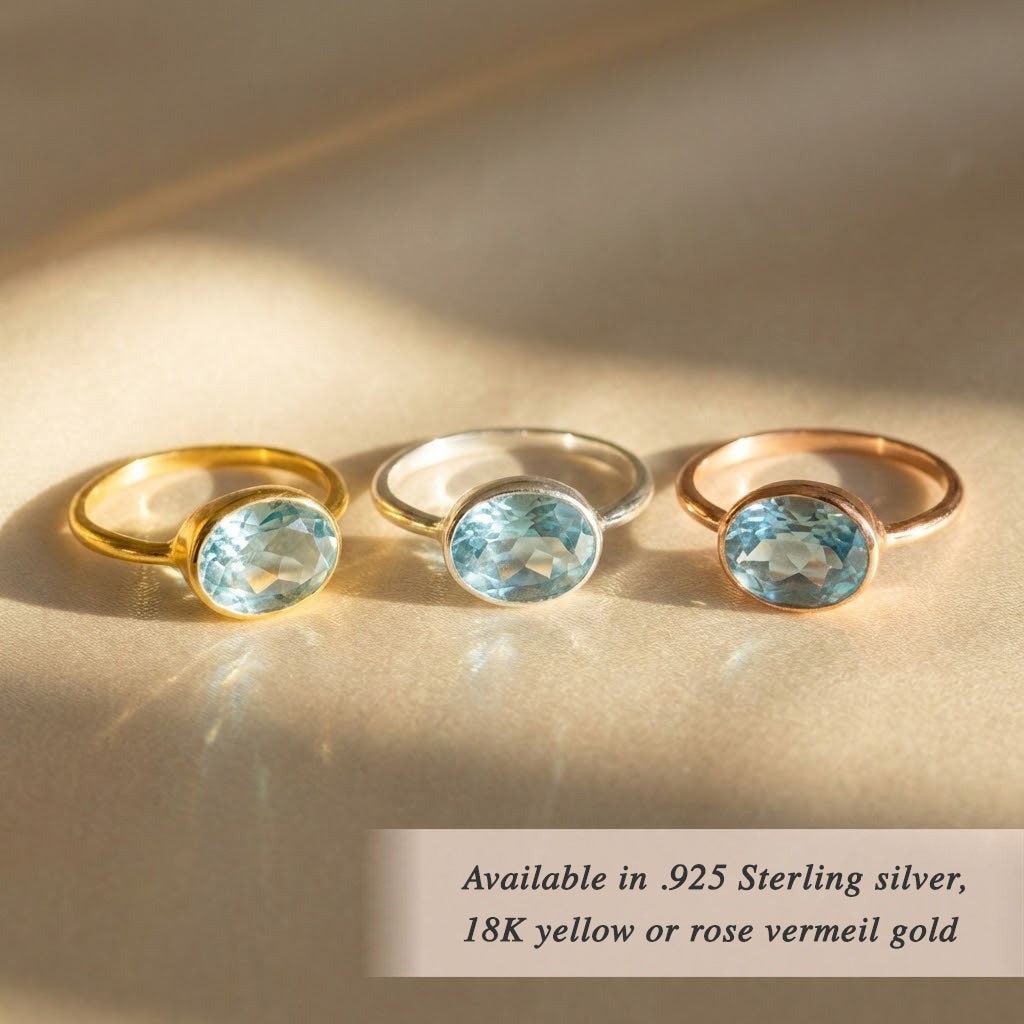 Oval blue topaz rings in sterling silver, yellow gold and rose gold settings, December birthstone gemstone ring collection for stacking and gifting