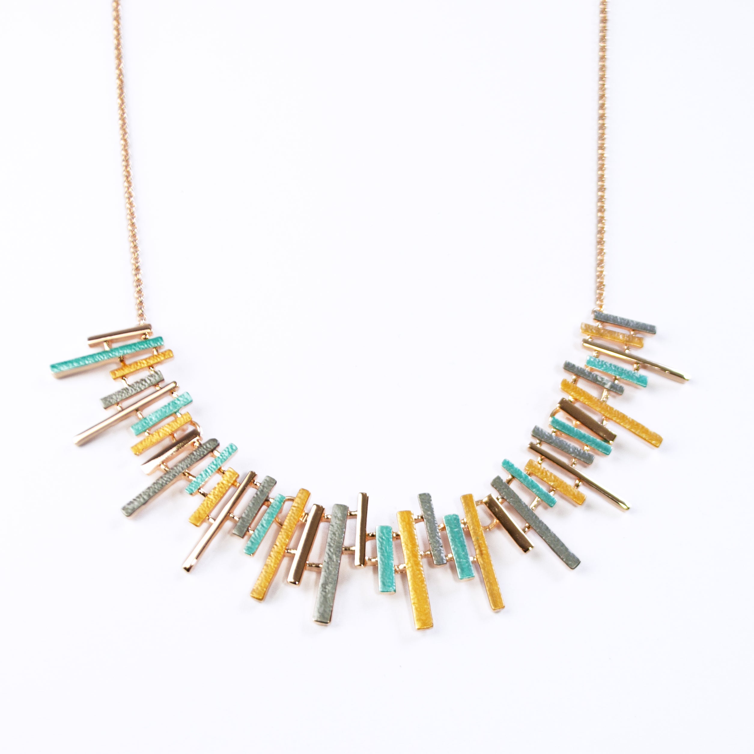 Adjustable Rose Gold Plated Necklace with a cable chain and connected pendants with vertical bars of varying lengths painted in teal, gray, and gold enamel against a white background