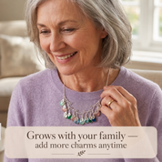 Grandma wearing personalized family tree birthstone necklace with grandchildren charms
