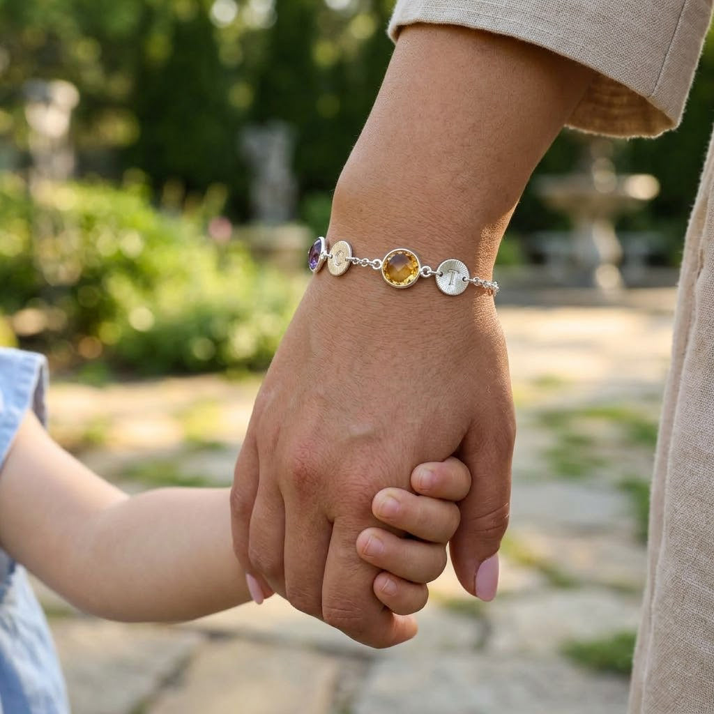 Meaningful mother and child moment featuring custom birthstone bracelet with initial charms, sentimental family jewelry gift for mom and motherhood