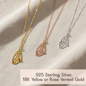 Set of three custom butterfly wing birthstone necklaces in yellow gold, rose gold and sterling silver on satin backdrop, personalized pendant jewelry available in multiple metal finishes.