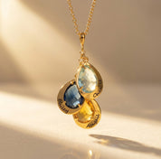 Personalized birthstone necklace for mom with teardrop gemstone charms and engraved names, a meaningful custom family necklace for mothers or grandmothers.